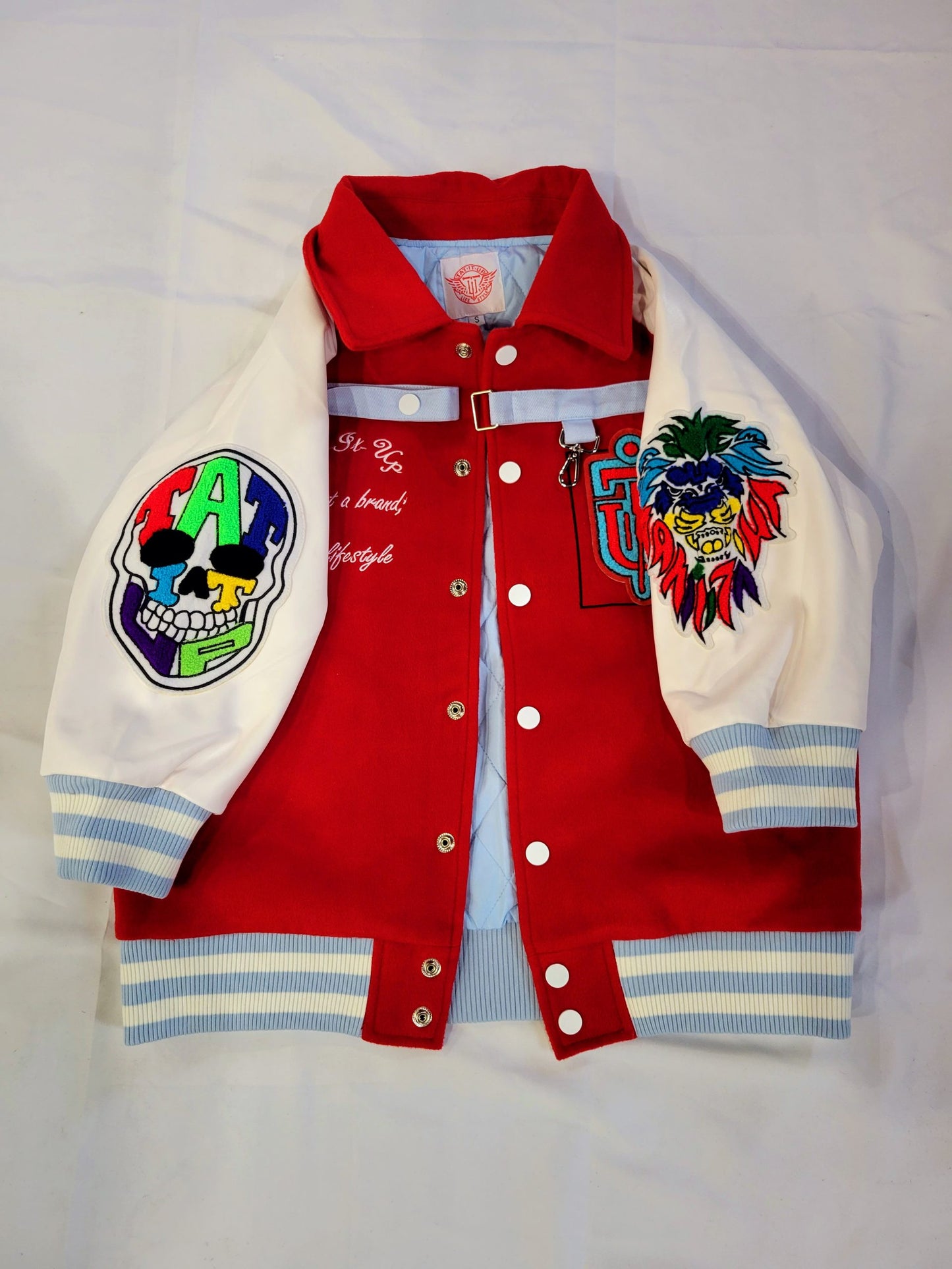 RED/WHITE “INKSANITY” 3/4 SLEEVE VARSITY JACKET.