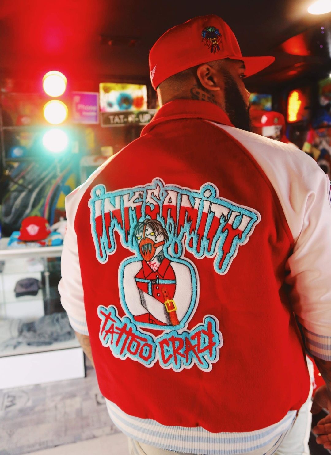 RED/WHITE “INKSANITY” 3/4 SLEEVE VARSITY JACKET.