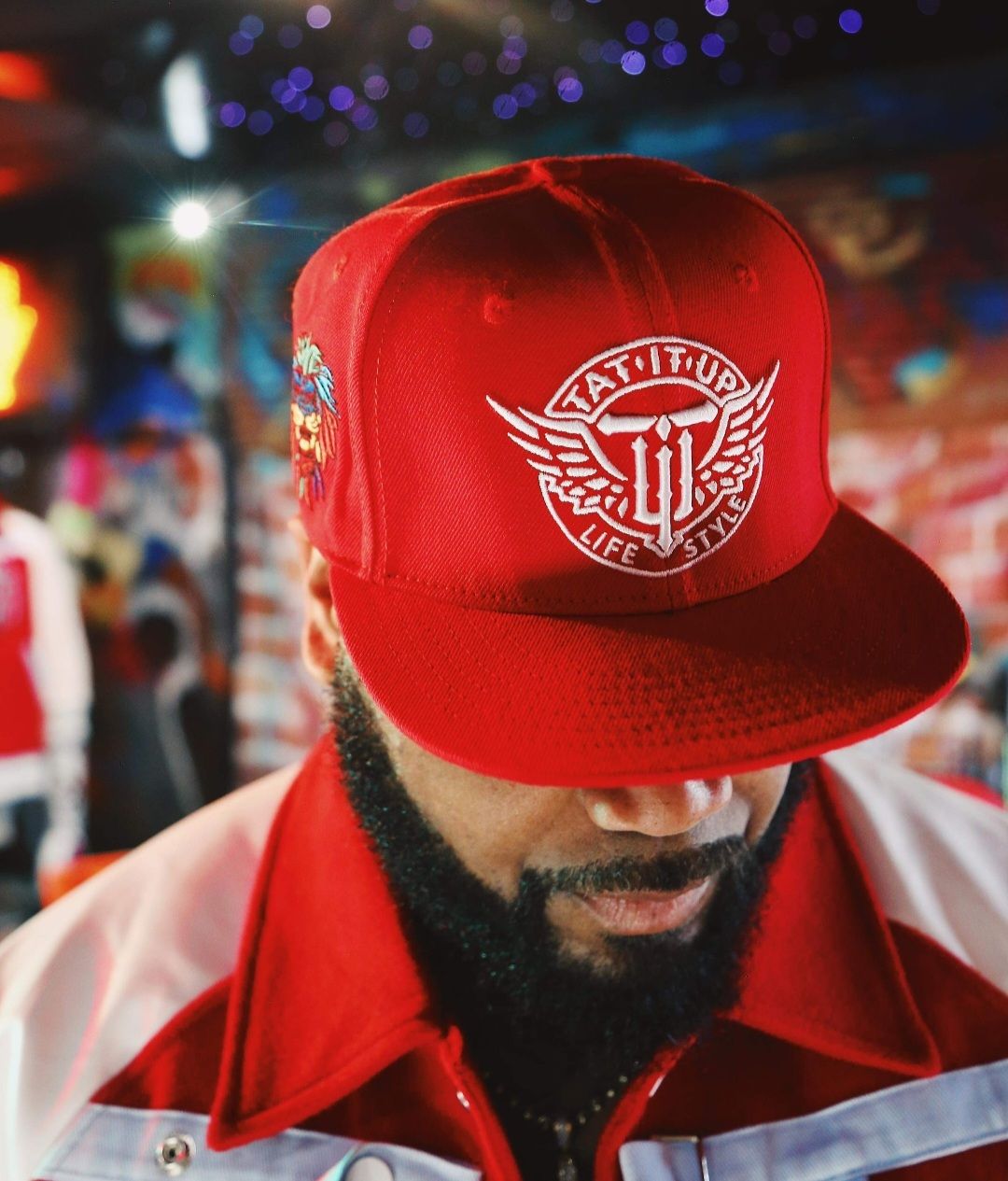 RED/WHITE “INKSANITY” 3/4 SLEEVE VARSITY JACKET.