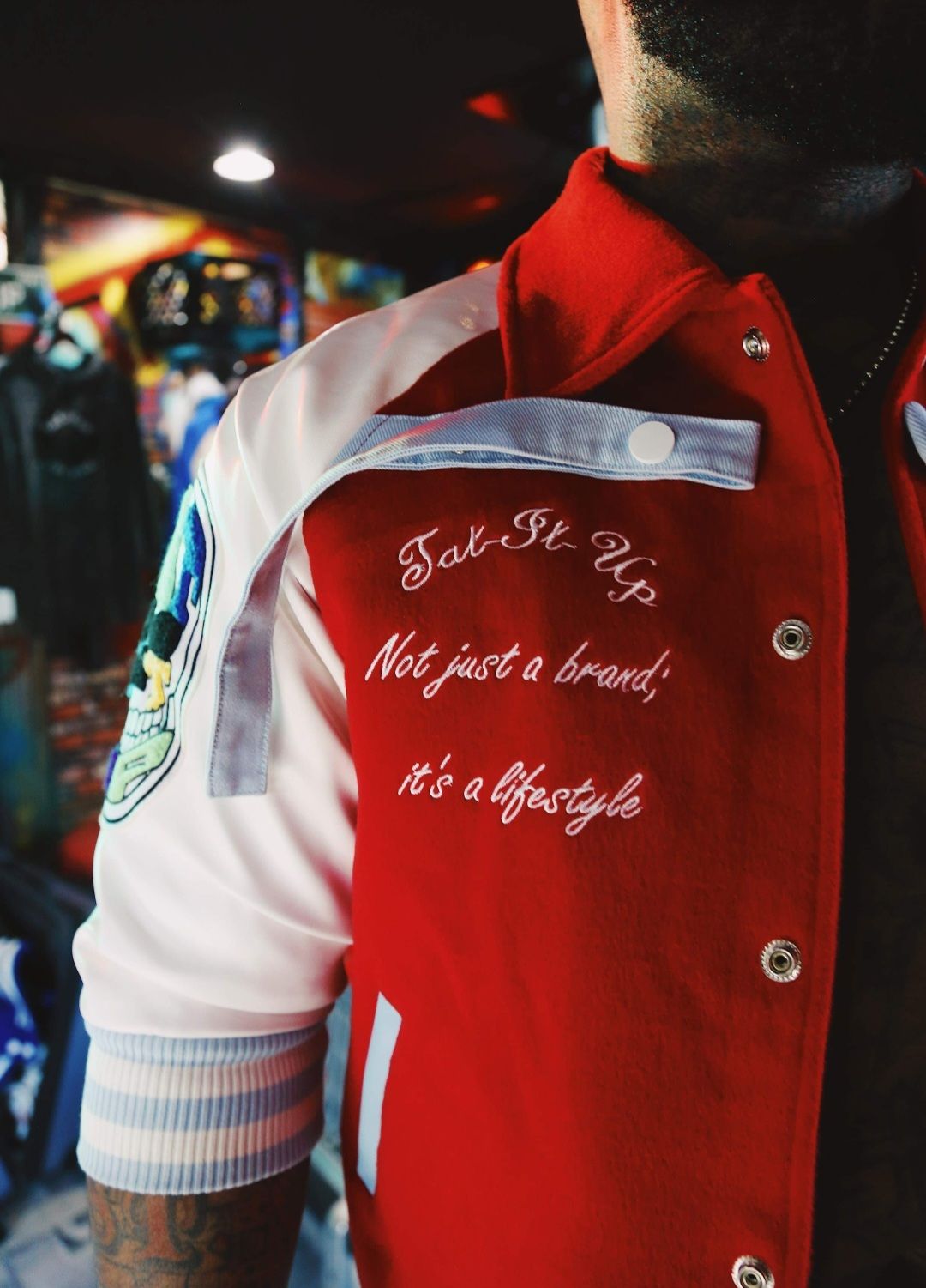 RED/WHITE “INKSANITY” 3/4 SLEEVE VARSITY JACKET.